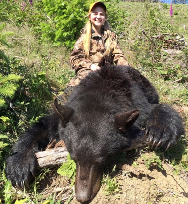 Image of a girl with a large black bear