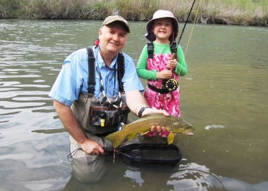 child and grandfather with an Owyhee River brown trout