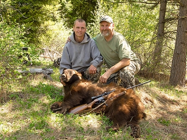 Ronald and Luke French with the spring bear they took in the Chesnimus Unit.