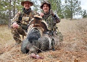 Father and son show turkey taken on HBR property
